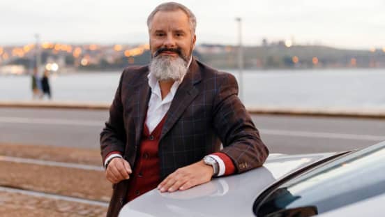 Uber driver next to car