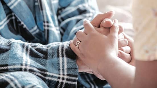 2 people holding hands