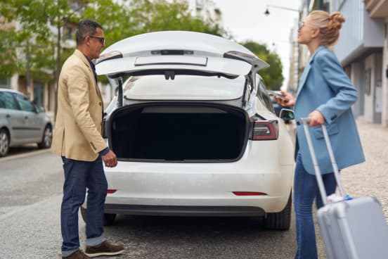 Putting luggage in trunk