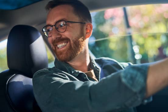 Male driver smiling